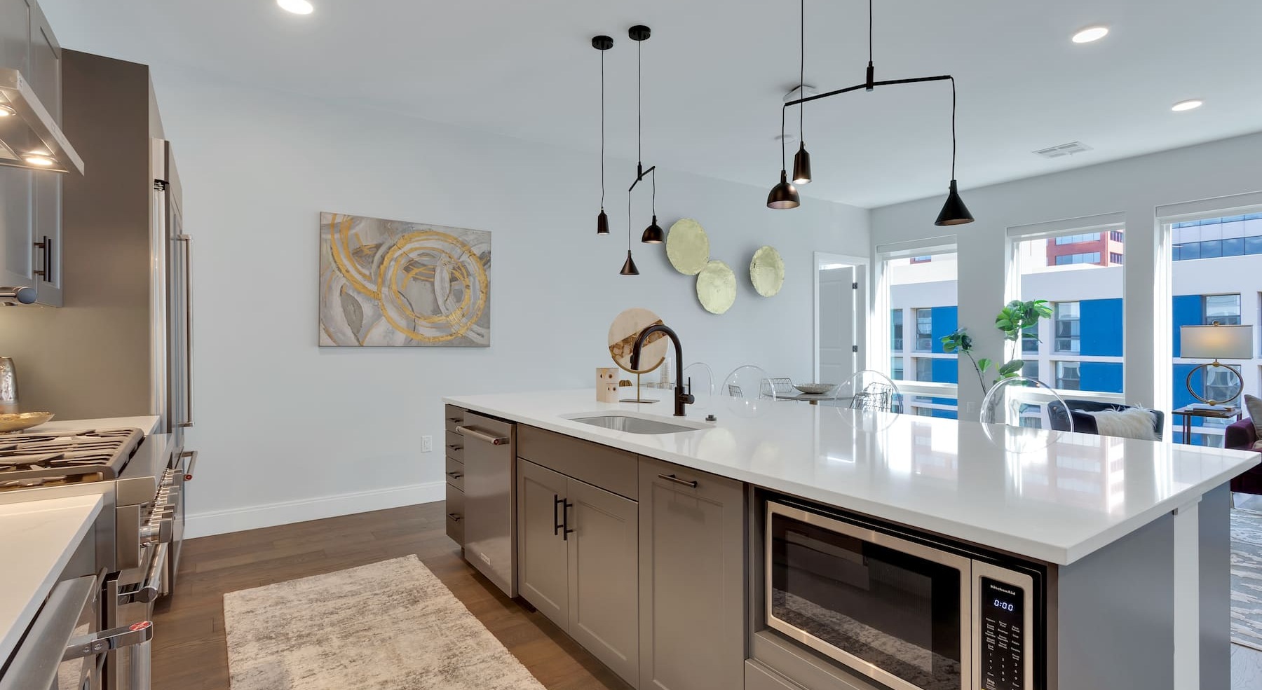 kitchen with colored cabinetry and modern appliances
