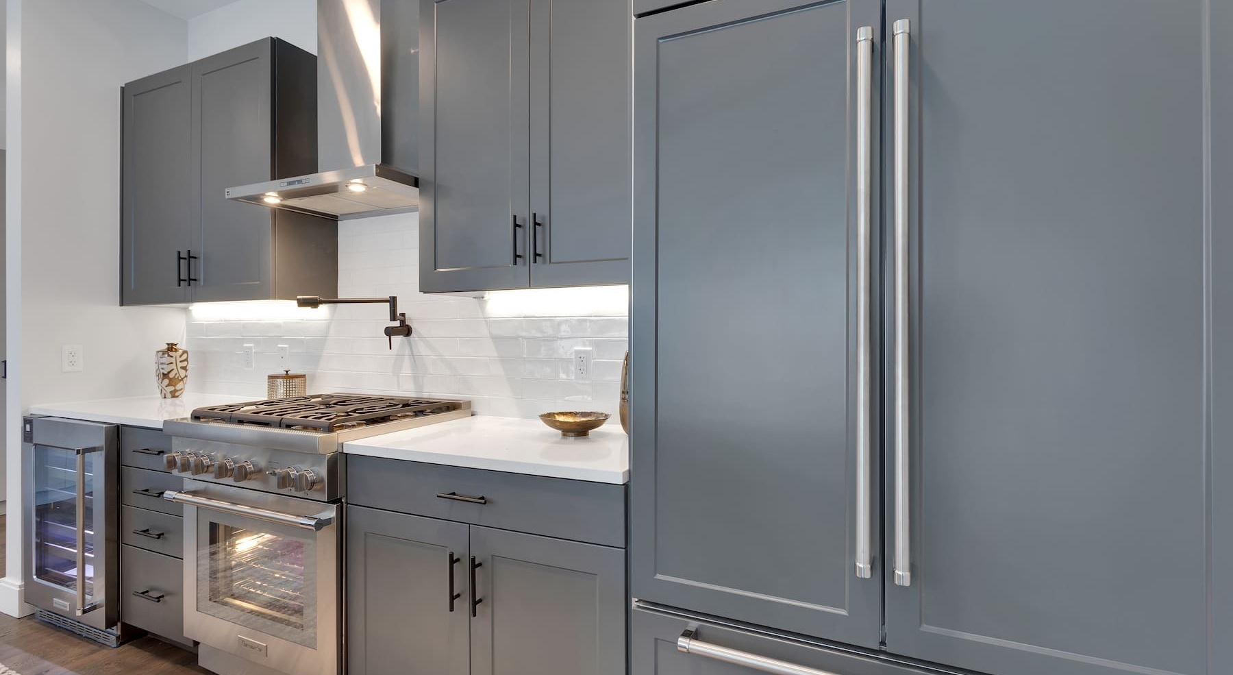 kitchen with colored cabinetry and modern appliances