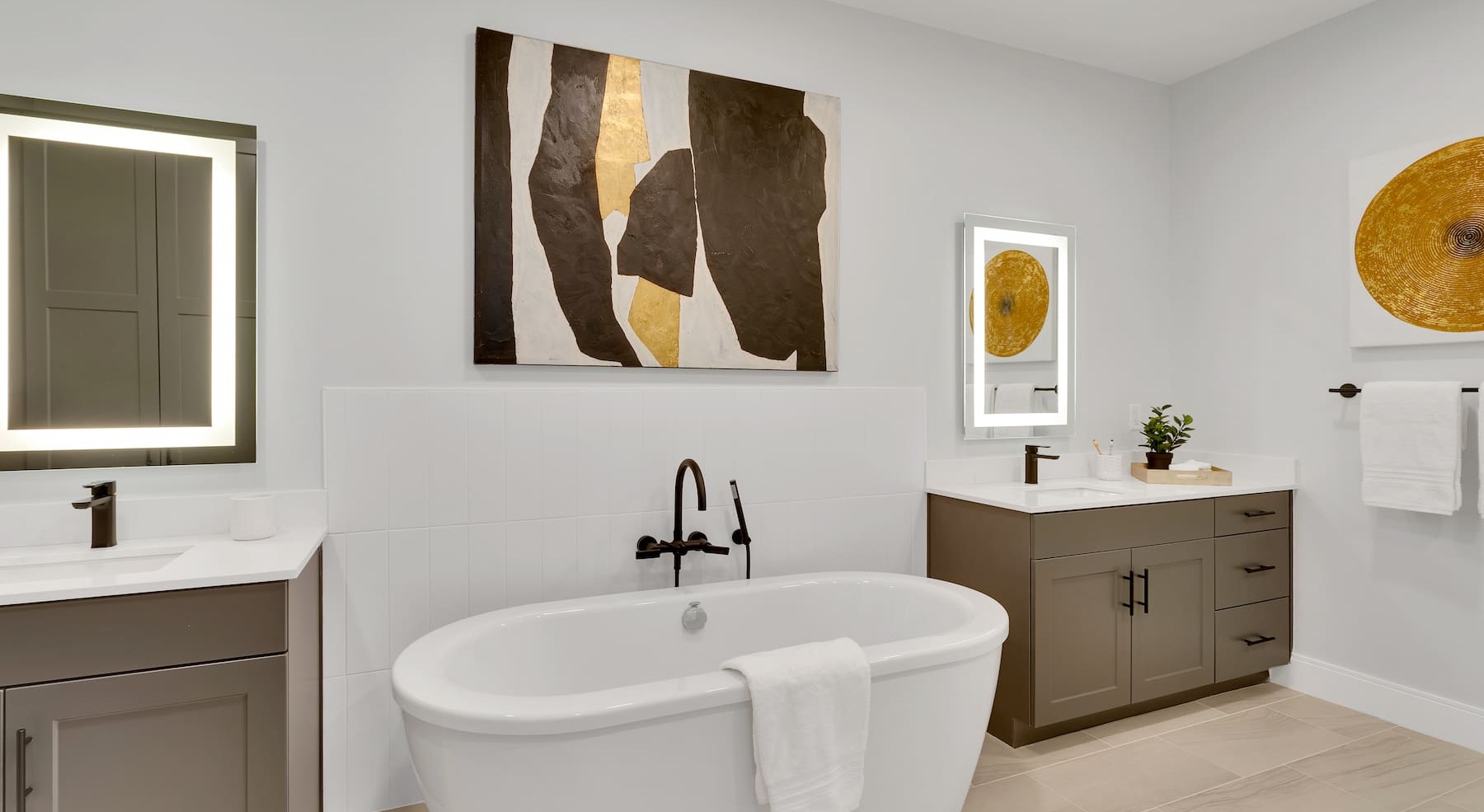 modern bathroom with a standalone tub and wall art