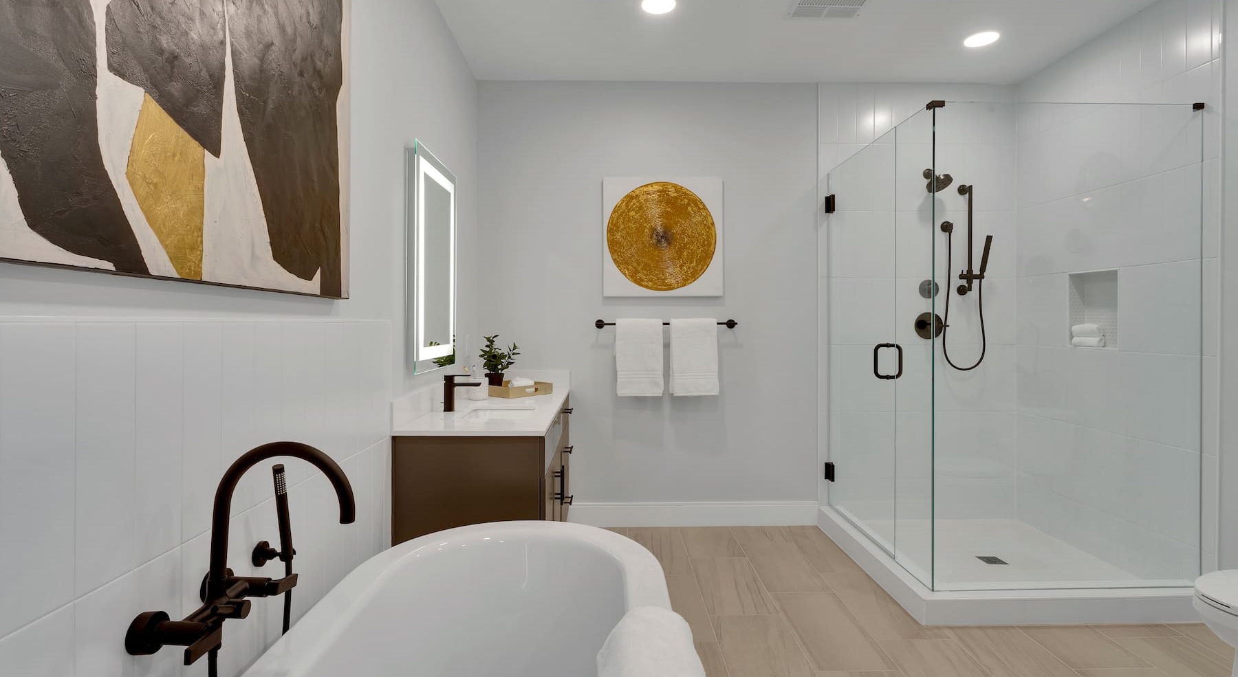 modern bathroom with a standalone tub and wall art