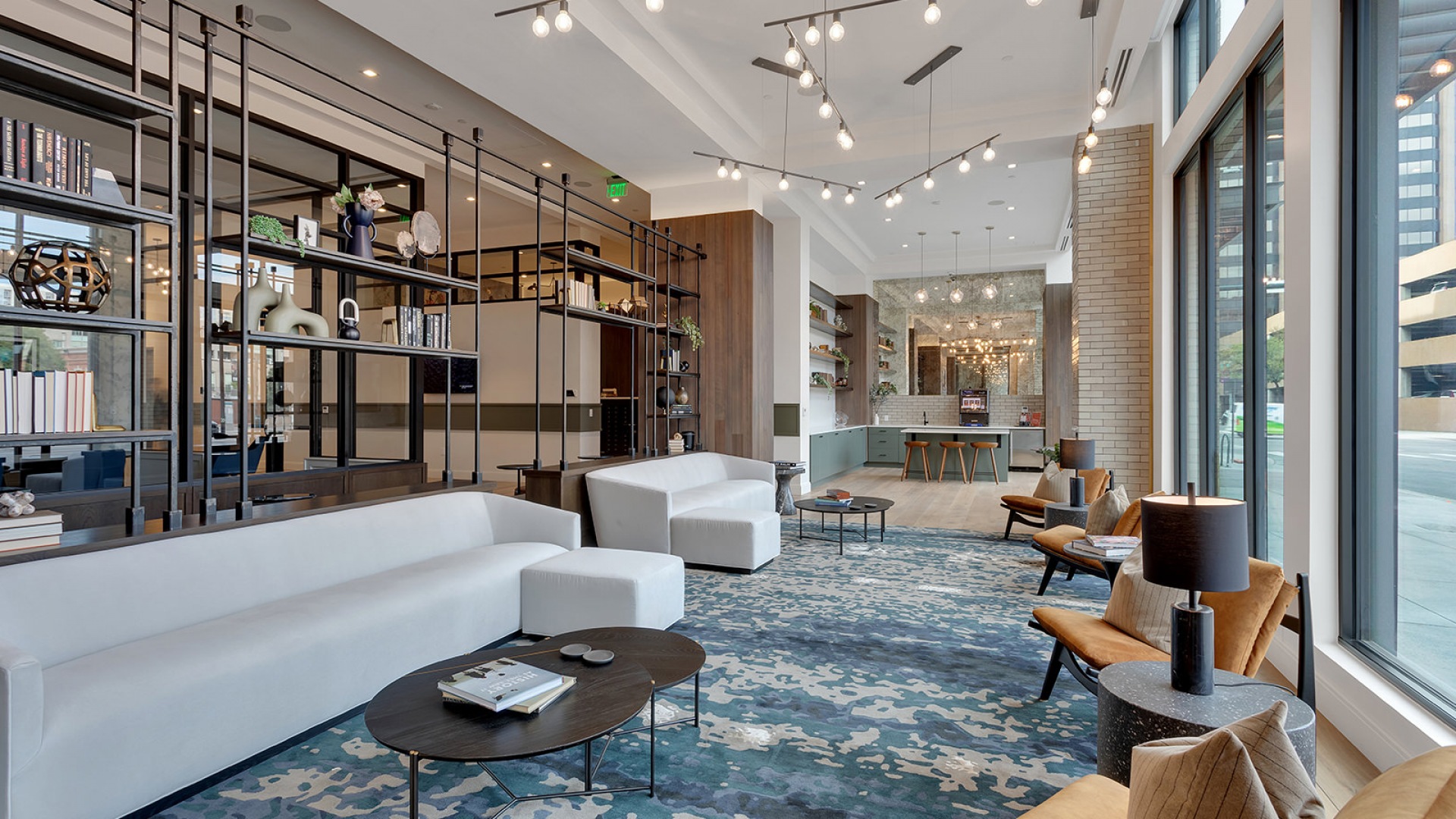 Elegant open-concept living space with modern furnishings, statement lighting, and floor-to-ceiling windows overlooking urban scenery.	 Elegant open-concept living space with modern furnishings, statement lighting, and floor-to-ceiling windows overlooking urban scenery.
